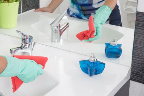 Kitchen surfaces and worktops being cleaned in a Camden home domestic cleaning visit